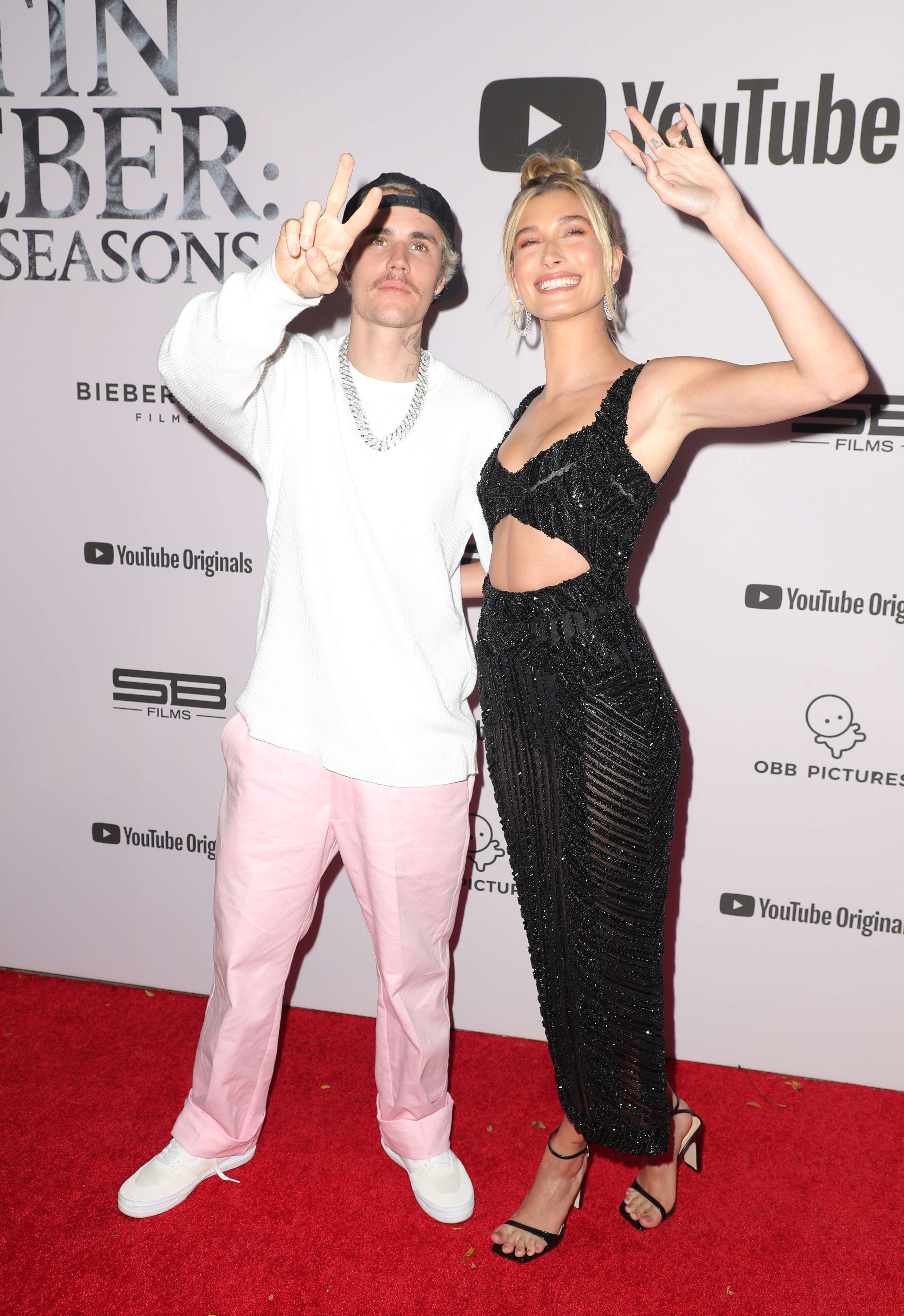Justin Bieber and Hailey Baldwin Throwing Up Peace Signs