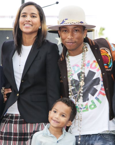 PHARRELL WILLIAMS, WIFE AND SON POSE IT UP DURING PFW 2023