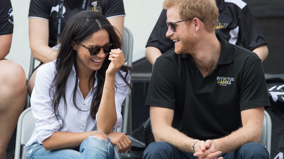 Meghan Markle and Prince Harry smiling.