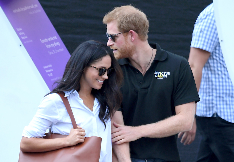 Meghan Markle and Prince Harry showing some PDA.