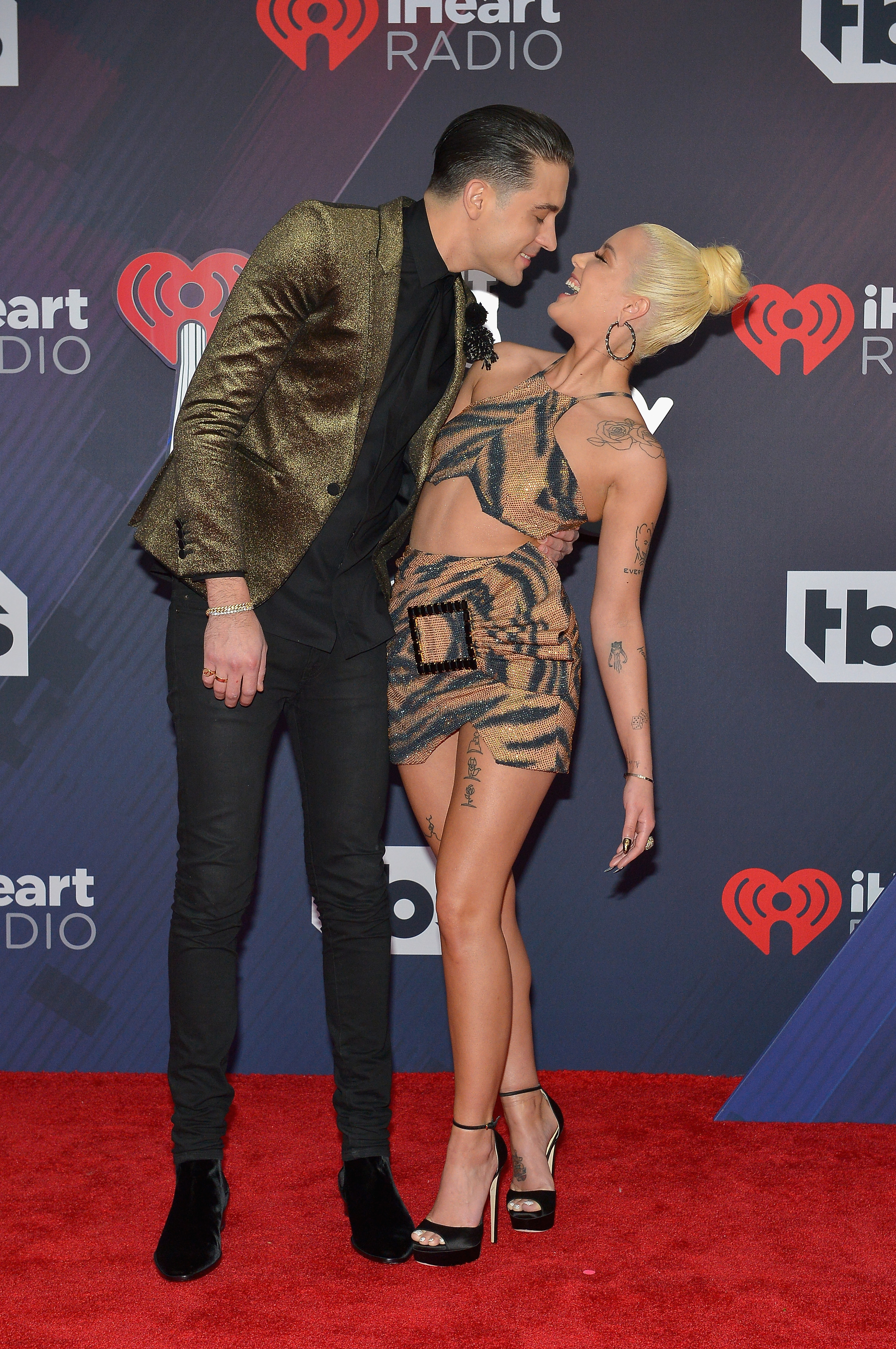 G-Eazy and Halsey show some PDA on a red carpet.