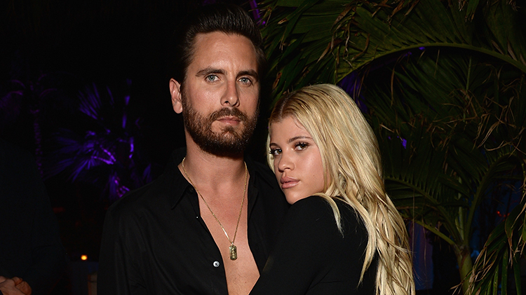 Scott Disick and Sofia Richie showing some PDA at an event.