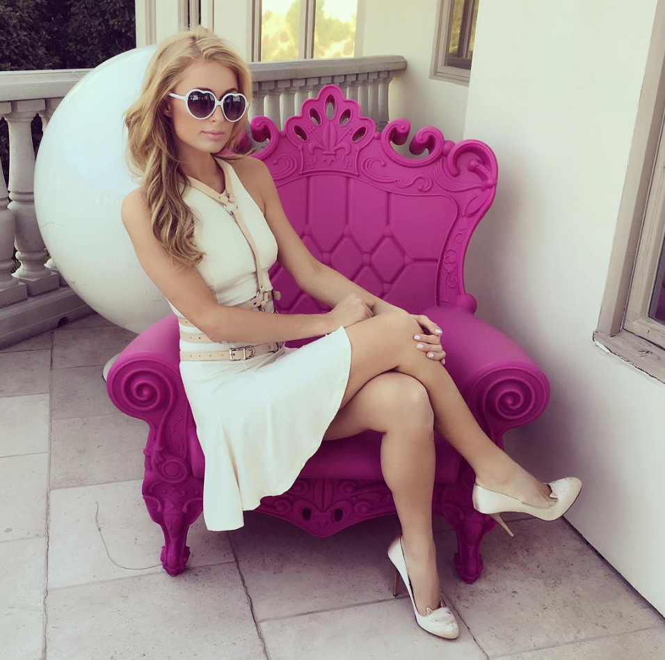 https://www.lifeandstylemag.com/wp-content/uploads/2018/07/paris-hilton-pink-throne.png?resize=956%2C948&quality=86&strip=all