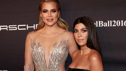 Khloe and Kourtney Kardashian posing