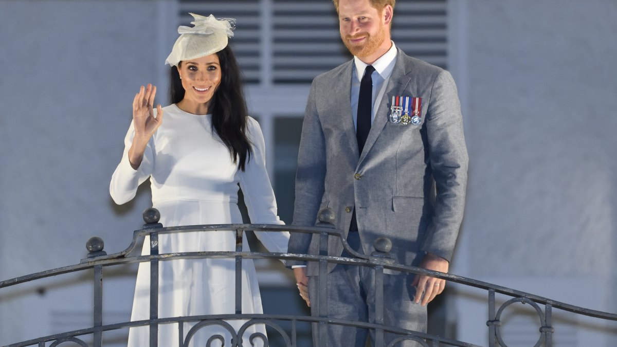 Meghan Markle and Prince Harry waving