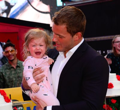 colton underwood holds a crying emmy tolbert