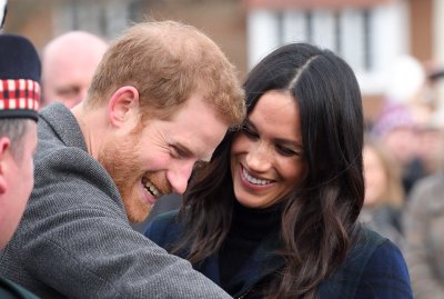 Prince Harry and Meghan Markle smiling