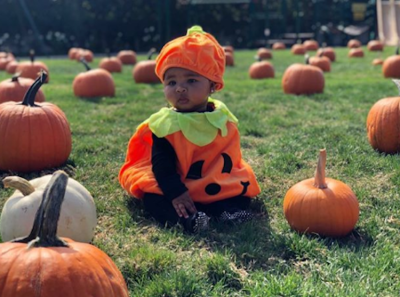 True Thompson wearing a pumpkin Halloween costume