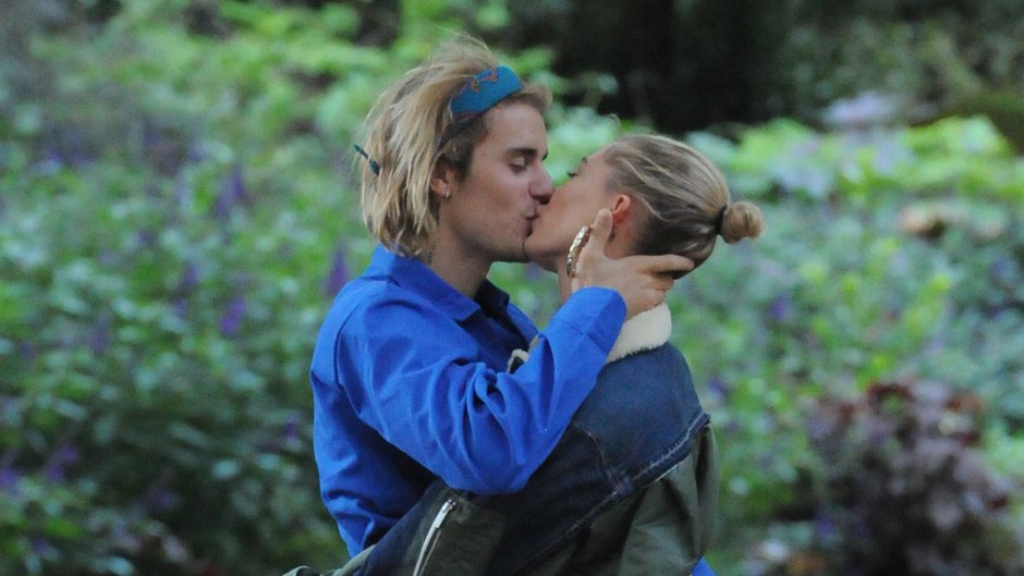 Justin Bieber and Hailey Baldwin kissing in London, Justin wearing a blue shirt and headband