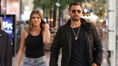 Scott Disick and Sofia Richie out together in Australia. Sofia wearing a black tank top and jeans
