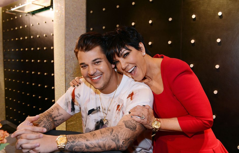 Rob Kardashian with his mom Kris Jenner, she is wearing a red shirt