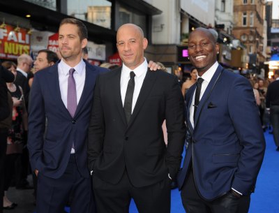 Paul Walker, Tyrese Gibson, and Vin Diesel at the premiere together all wearing suits
