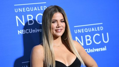 Khloe Kardashian wearing a black top at a red carpet