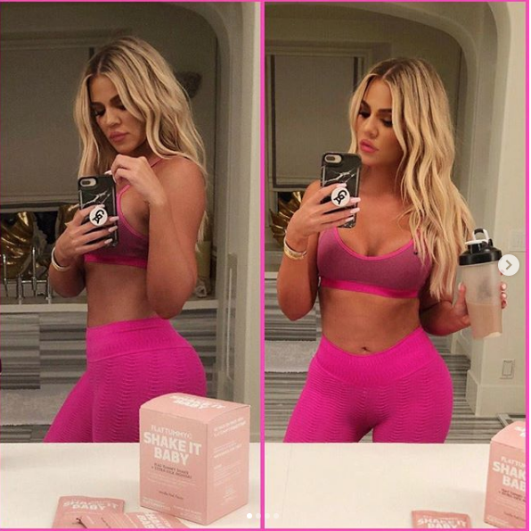 Khloe Kardashian wearing a pink workout outfit