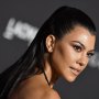 Kourtney Kardashian posing