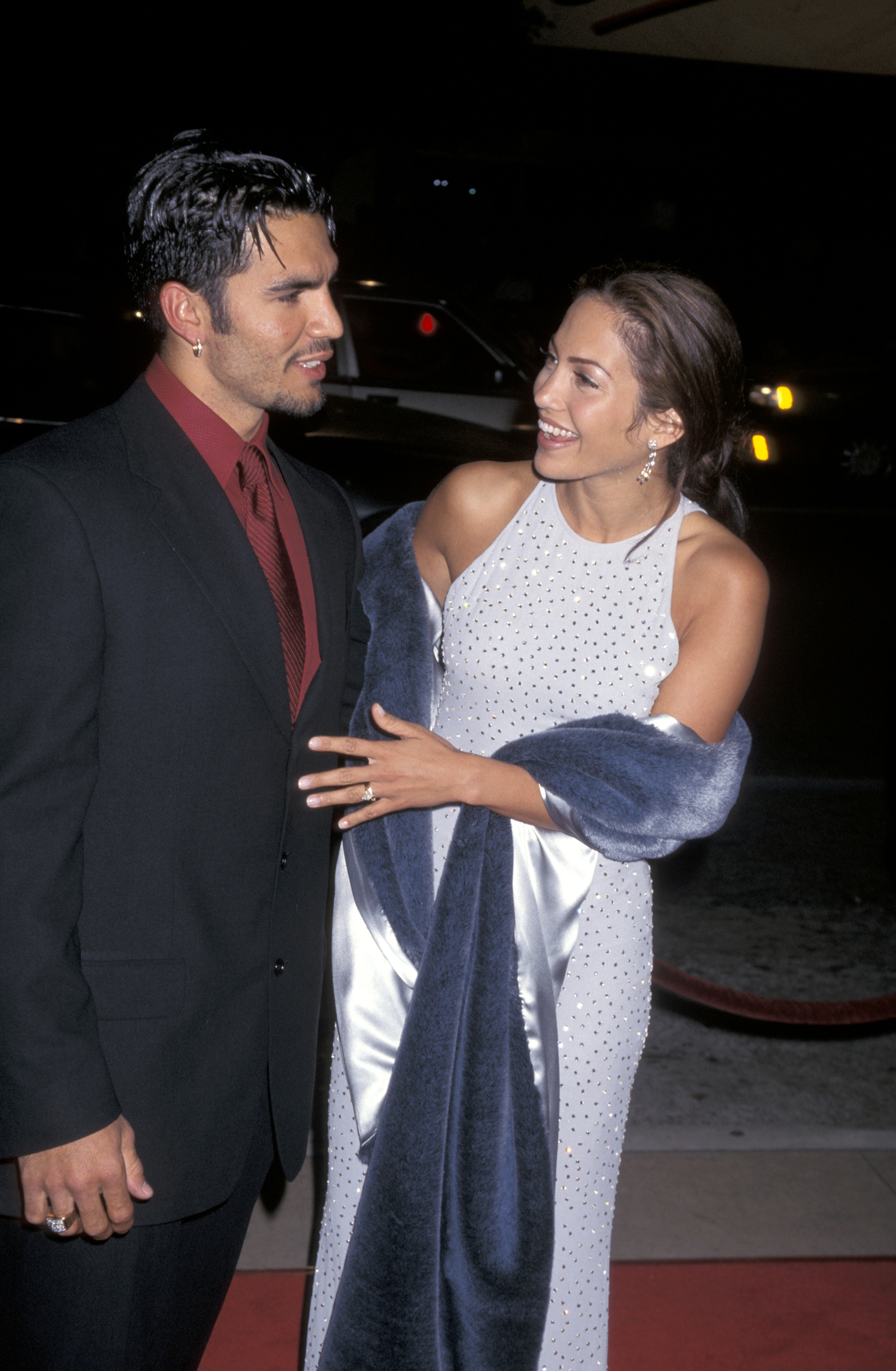 Jennifer Lopez, wearing purple with first husband Ojani