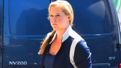 Amy Schumer Walking In Front Of Blue Van