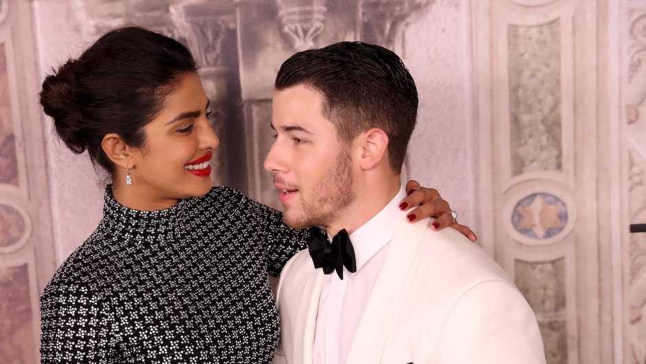 Nick Jonas and Priyanka Chopra giving each other a lovey look at an event
