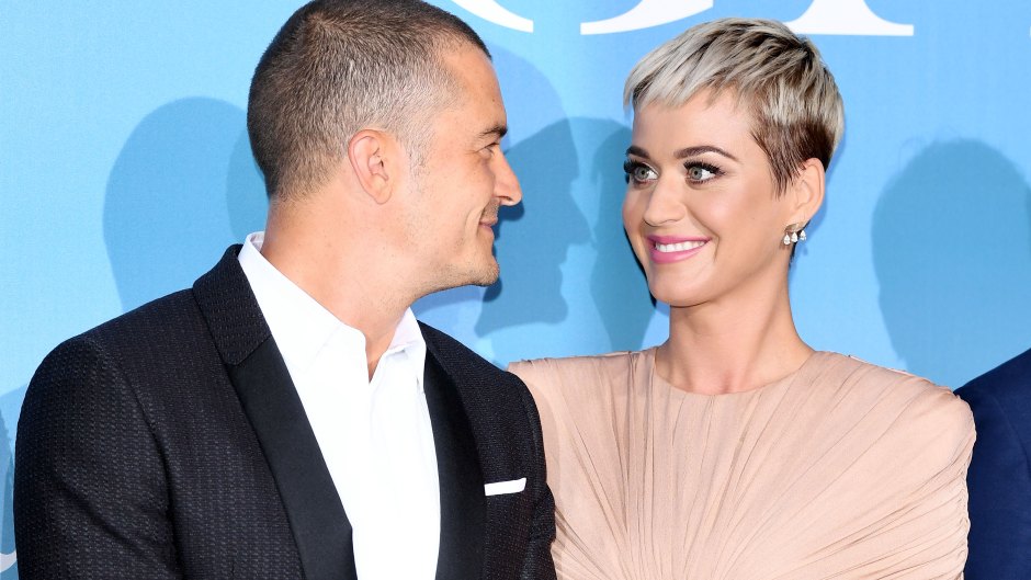 Katie Perry, Orlando Bloom, Smiling at each other, red carpet event