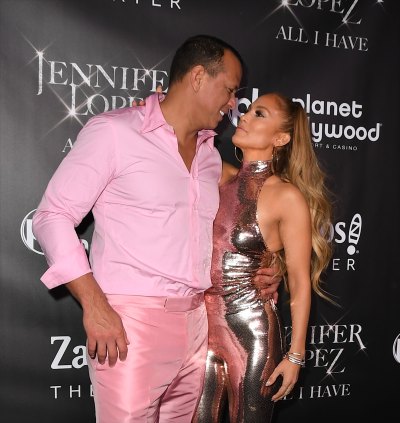 Alex Rodriguez dressed in all pink with Jennifer Lopez on red carpet
