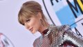 Taylor Swift at the AMA red carpet, wearing disco ball like dress