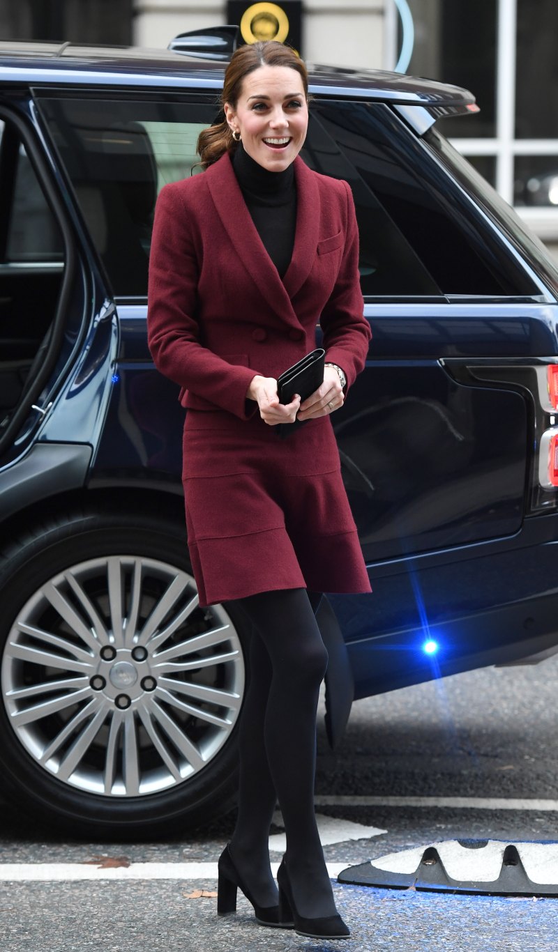 Kate Middleton red suit and skirt stepping out of a car