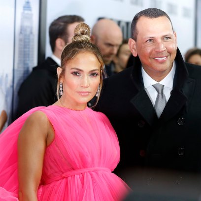 Jennifer Lopez wearing a hot pink dress with Alex Rodriguez