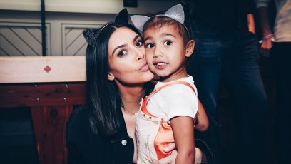 Kim Kardashian and North West at an Ariana Grande concert, wearing cat ears