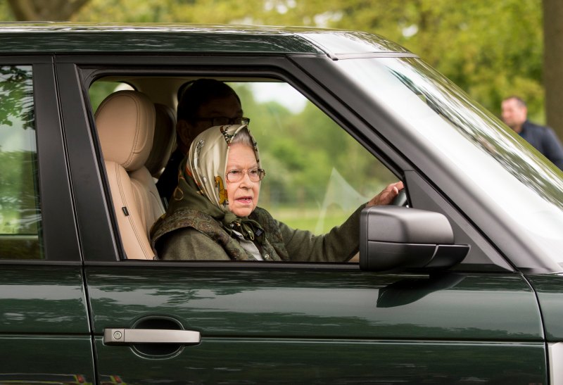 Queen Elizabeth driving a car