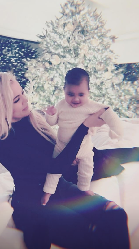 Khloe and True with Christmas tree