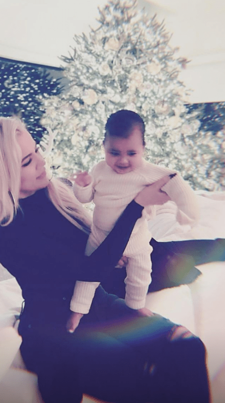 Khloe and True with Christmas tree