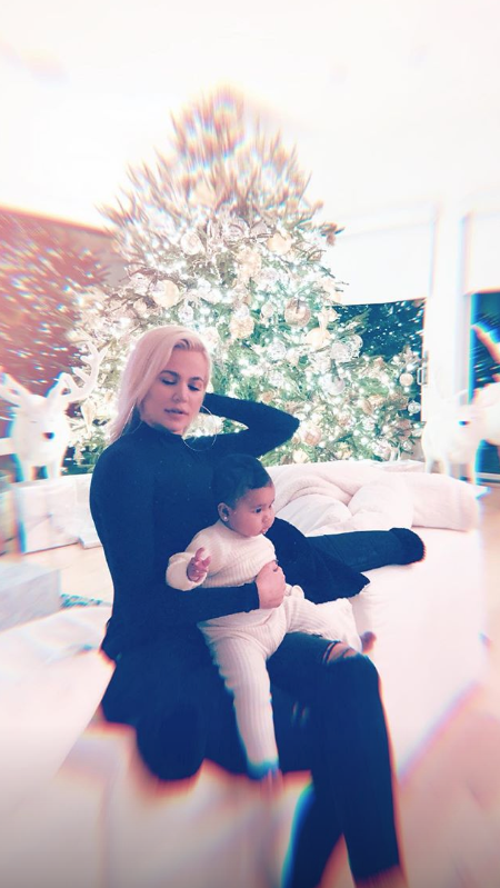 Khloe and True with Christmas tree