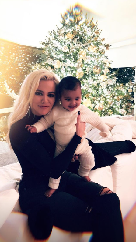 Khloe and True with Christmas tree
