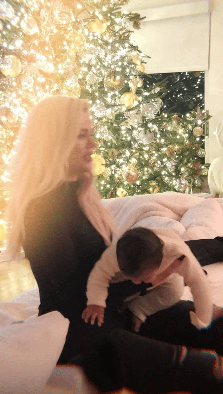 Khloe and True with Christmas tree