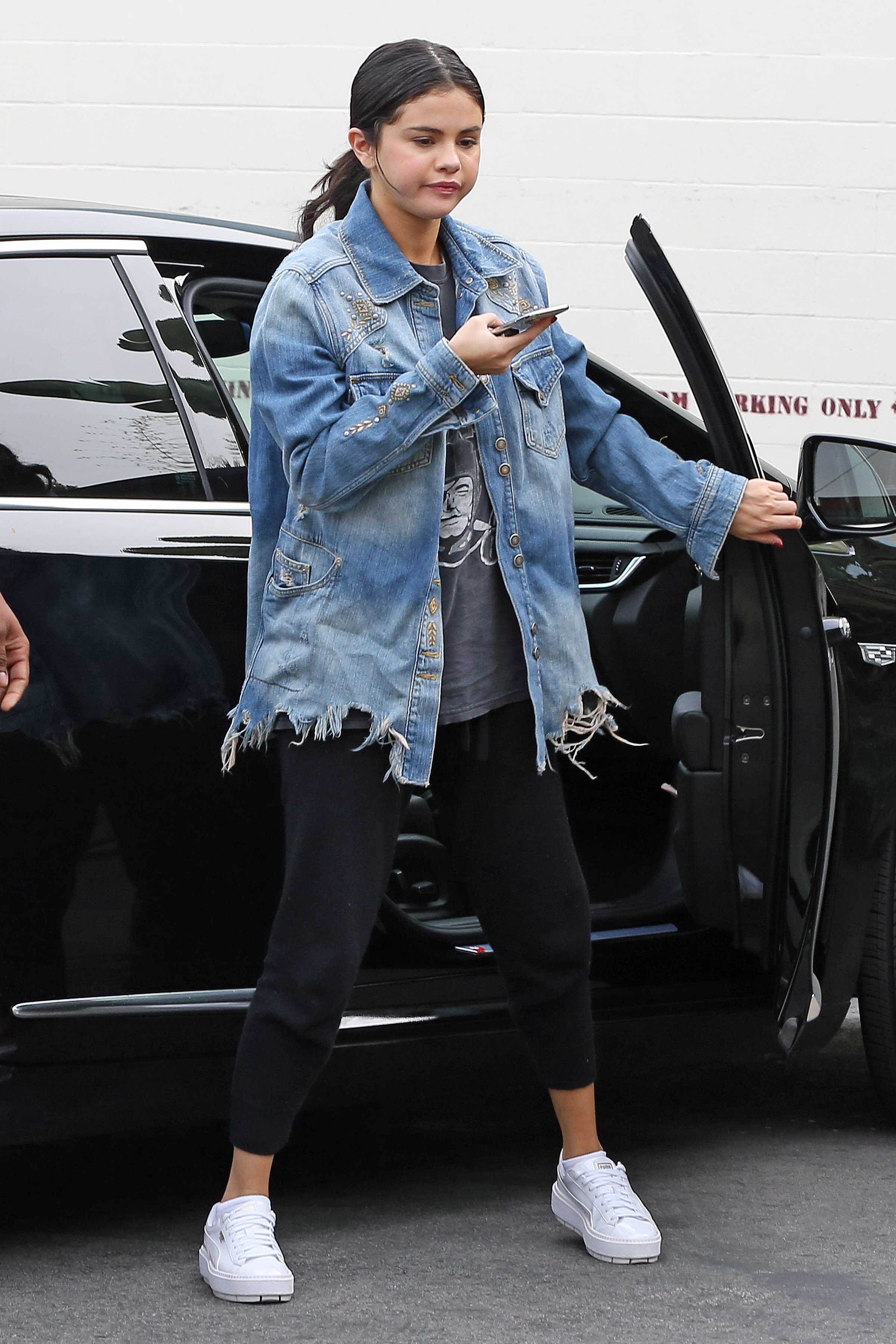 Selena Gomez, Black Pants, Jean Jacket, White Sneakers, Walking