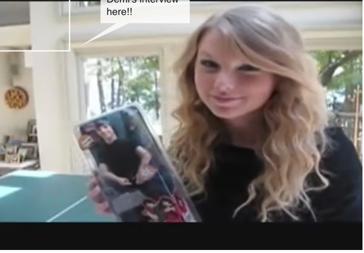 Taylor Swift taking a phone call