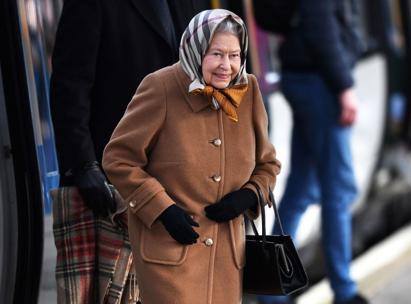 The Queen Wraps Up To Keep Warm While Riding Public Train Ahead Of The Holidays