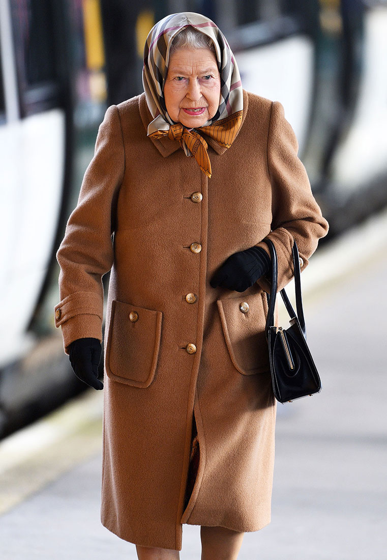 The Queen Wraps Up To Keep Warm While Riding Public Train Ahead Of The Holidays