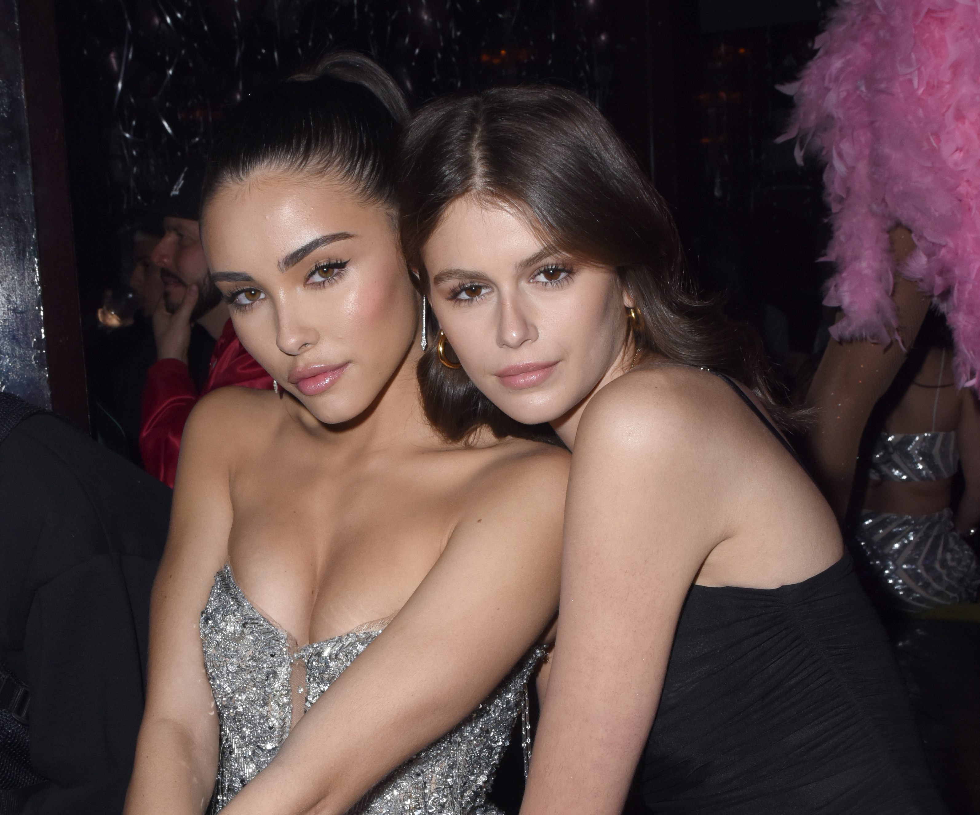 Kaia Gerber wearing black and a friend