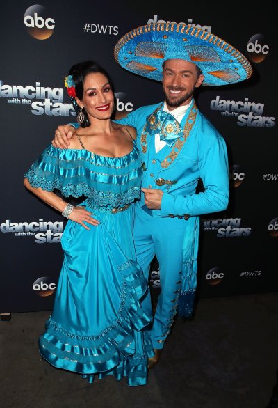 Nikki Bella posing with her Dancing With the Stars partner Artem Chigvintsev