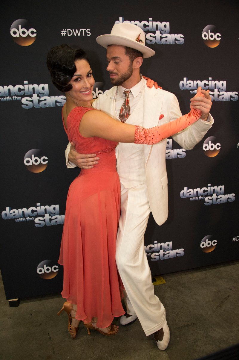 Nikki Bella posing with her Dancing With the Stars partner Artem Chigvintsev