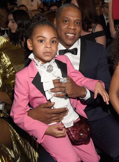 Blue Ivy Wearing a Pink Suit Being Held By Jay-Z