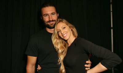 Brandon and Leah Jenner posing and smiling wearing all black outfits