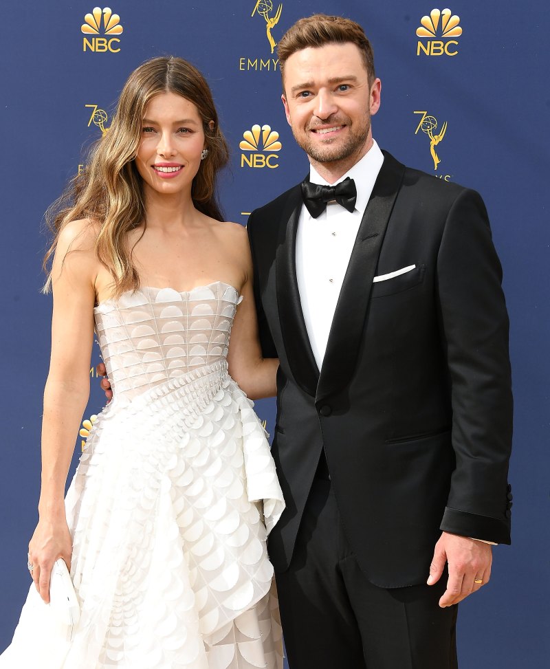 Jessica Biel wearing a white dress with Justin Timberlake in a suit