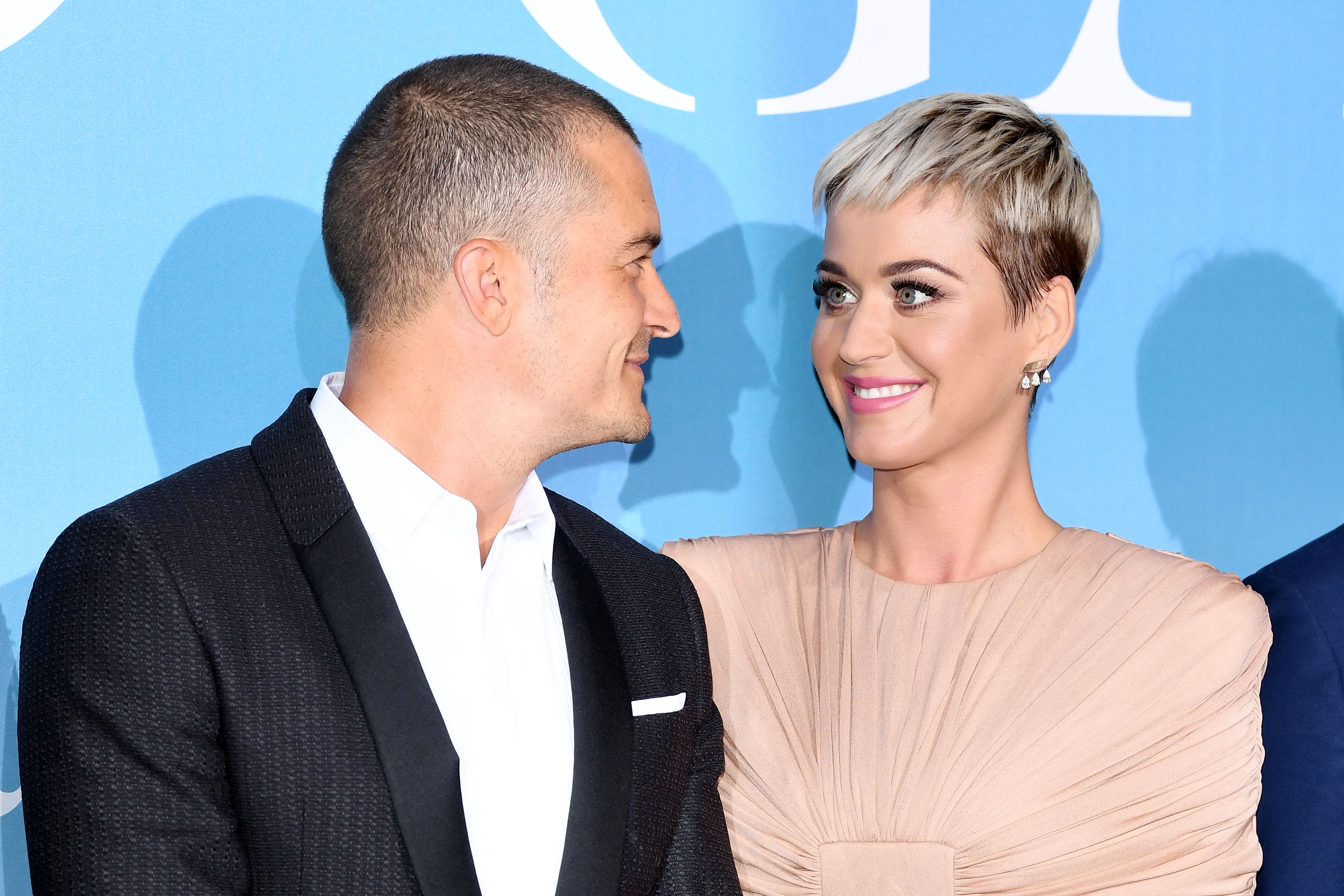 Orlando Bloom with girlfriend Katy Perry in a pink dress