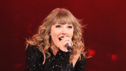 Taylor Swift performing in Japan, wearing a black dress