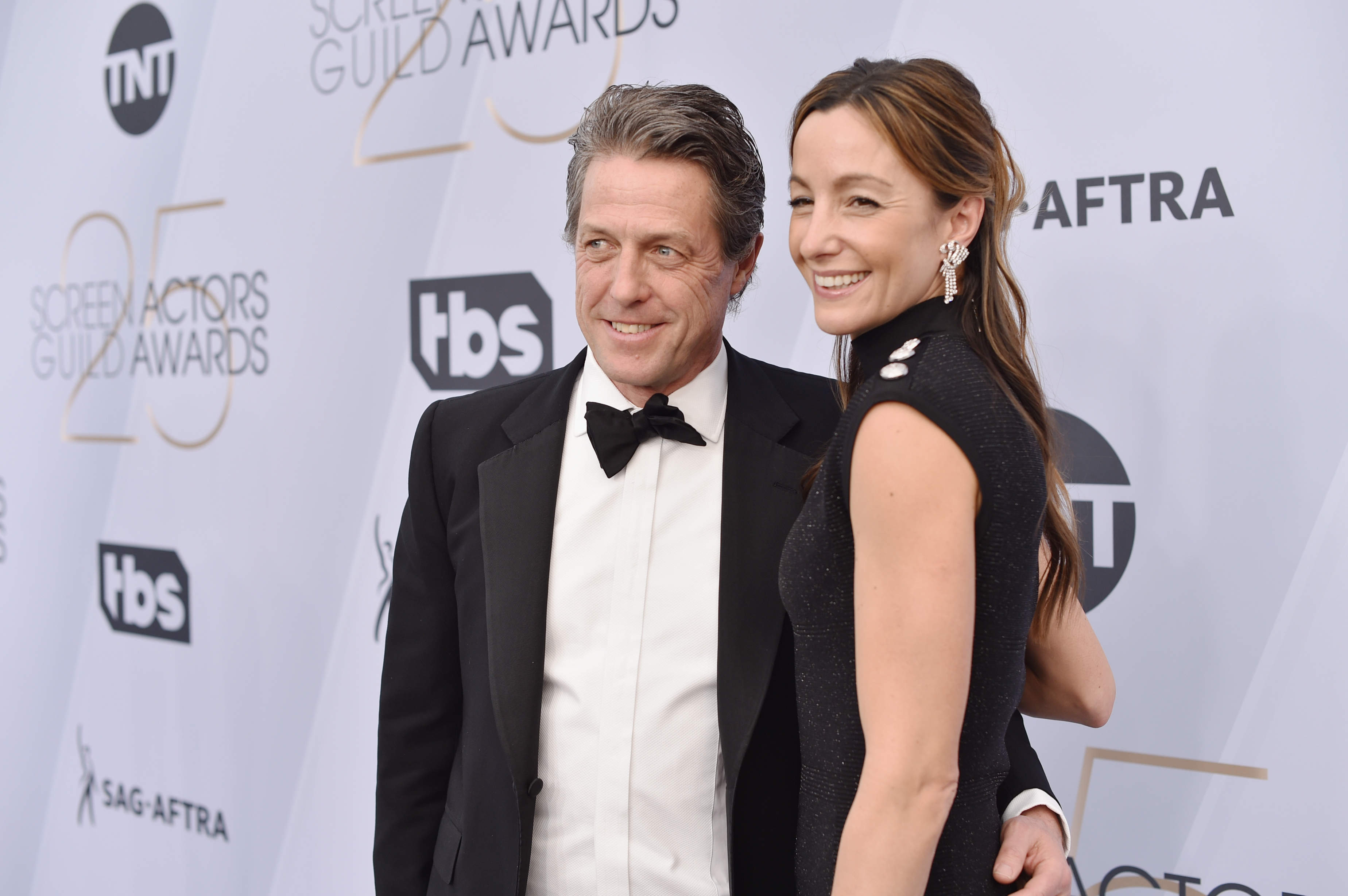 Hugh Grant with his wife
