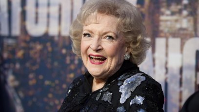 Betty White up close shot of her smiling in a black dress