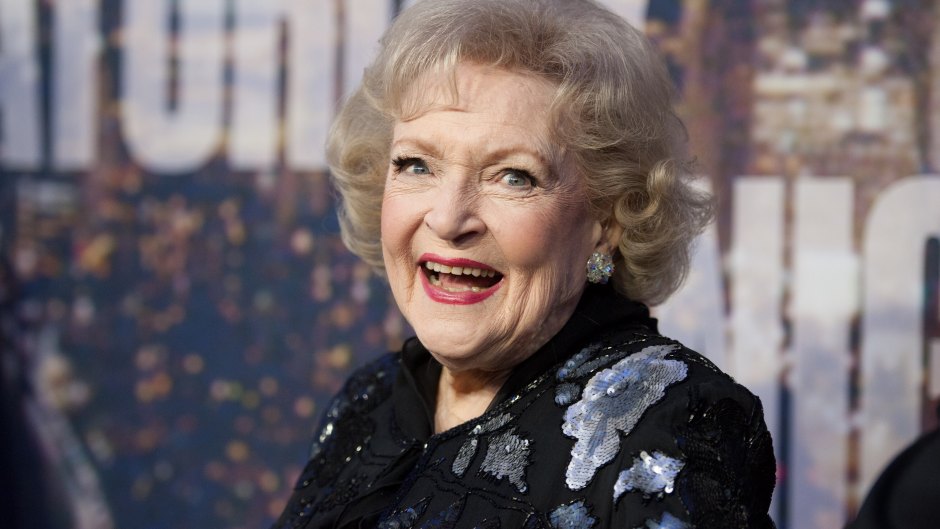 Betty White up close shot of her smiling in a black dress
