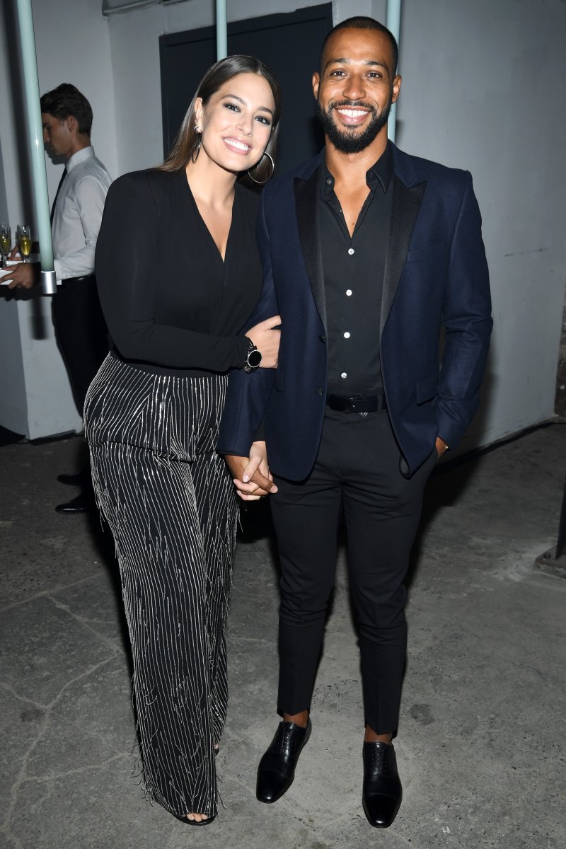 Ashley Graham posing with her husband Justin Ervin